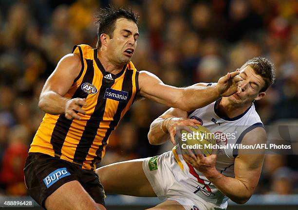 Brian Lake of the Hawks and Josh Jenkins of the Crows in action during the 2015 AFL Second Semi Final match between the Hawthorn Hawks and the...