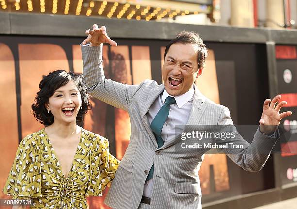 Kaho Minami and Ken Watanabe arrive at the Los Angeles premiere of "Godzilla" held at Dolby Theatre on May 8, 2014 in Hollywood, California.