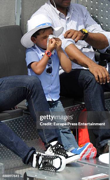 Real Madrid footballer Cristiano Ronaldo's son Cristiano Ronaldo Junior watches Rafael Nadal of Spain against Jarkko Nieminen of Finland in their...