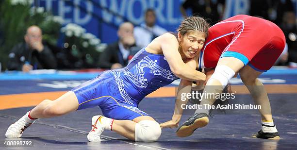 Saori Yoshida of Japan and Jong Myong Suk of North Korea compete in the Women's Freestyle -53kg semifinal during day three of the World Wrestling...