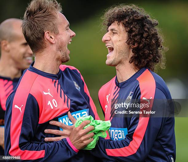 Siem de Jong and Fabricio Coloccini laugh during the Newcastle United Training session at The Newcastle United Training Centre on September 18 in...