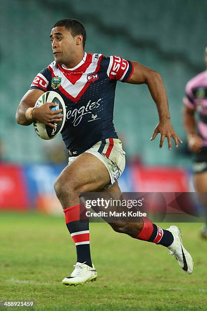 Michael Jennings of the Roosters makes a break on his way to score a try during the round nine NRL match between the Sydney Roosters and the Wests...