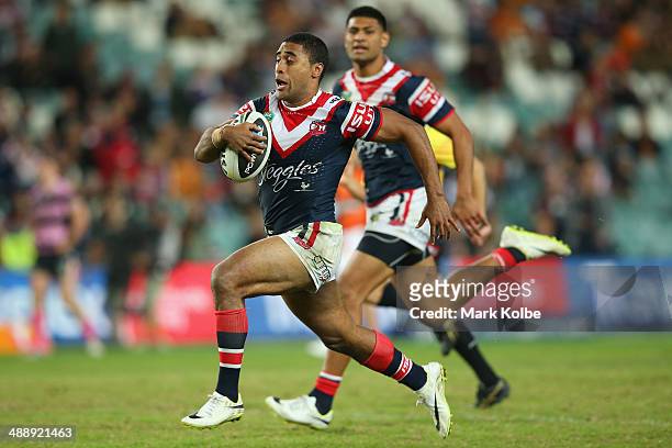 Michael Jennings of the Roosters makes a break on his way to score a try during the round nine NRL match between the Sydney Roosters and the Wests...