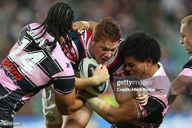 Dylan Napa of the Rootsers is tackled during the round nine NRL match between the Sydney Roosters and the Wests Tigers at Allianz Stadium on May 9,...