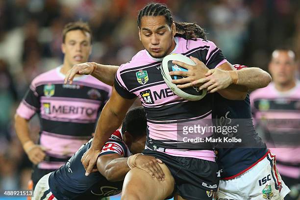 Ava Seumanufagai of the Tigers is tackled during the round nine NRL match between the Sydney Roosters and the Wests Tigers at Allianz Stadium on May...