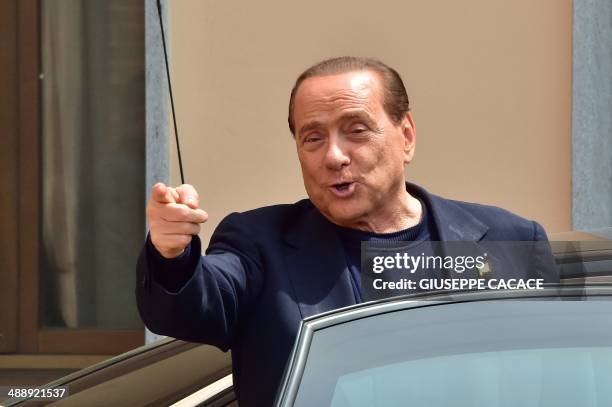 Italian former Prime Minister Silvio Berlusconi leaves the Catholic hospice "Sacra Famiglia" in Cesano Boscone after his first day of community...