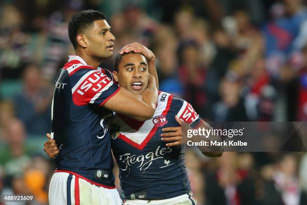 Daniel Tupou of the Roosters congratulates Michael Jennings of the Roosters as he celebrates scoring a try during the round nine NRL match between...