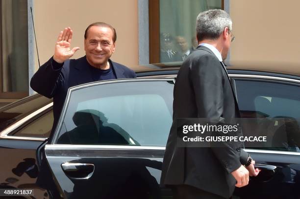 Italian former Prime Minister Silvio Berlusconi leaves the Catholic hospice "Sacra Famiglia" in Cesano Boscone after his first day of community...