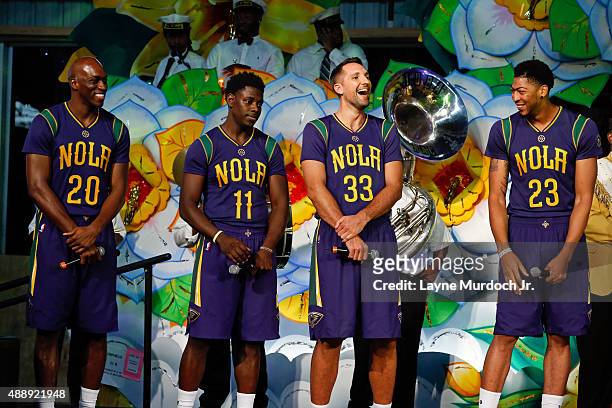 Quincy Pondexter, Jrue Holiday, Ryan Anderson and Anthony Davis of the New Orleans Pelicans unveil their Mardi Gras-themed Pride uniforms to be worn...