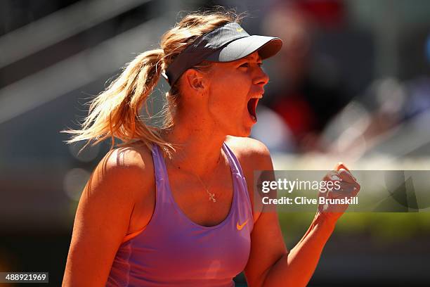 Maria Sharapova of Russia celebrates winning the second set against Na Li of China in their quarter final match during day seven of the Mutua Madrid...