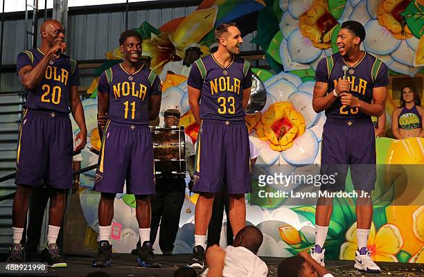 Quincy Pondexter, Jrue Holiday, Ryan Anderson and Anthony Davis of the New Orleans Pelicans unveil their Mardi Gras-themed Pride uniforms to be worn...