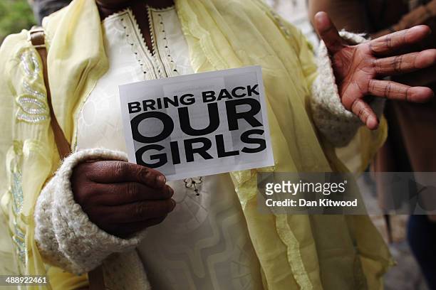 Woman holds a sign that reads 'Bring back our girls' during a protest outside Nigeria House on May 9, 2014 in London, England. 276 schoolgirls were...
