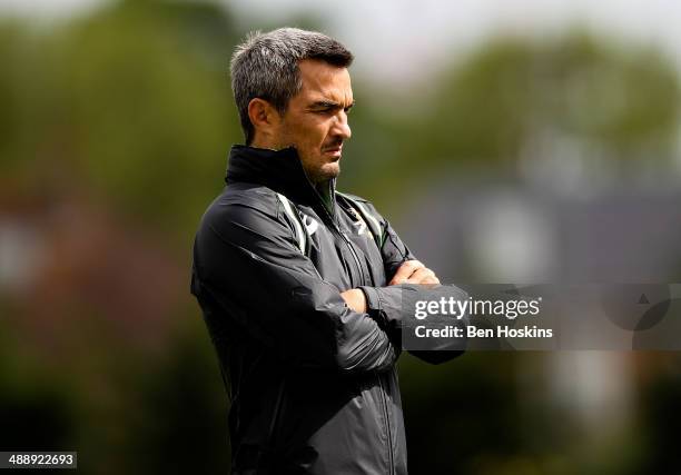 South Africa head coach Neil Powell looks on during the South Africa Rugby 7's training session at the London Wasps training groung on May 9, 2014 in...