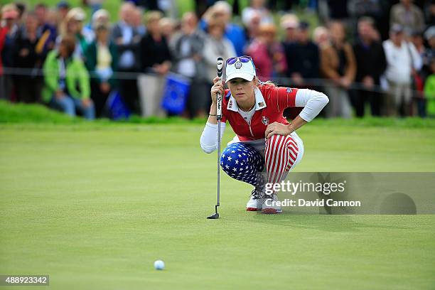 Paua Creamer of the United States Team lines a put at the 9th hole during the afternoon fourball matches on day one of the Solheim Cup 2015 at St...