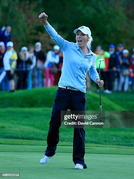 Melissa Reid of the European Team holes a birdie putt on the 16th green in her match with Carlota Ciganda during the Friday afternoon fourball...