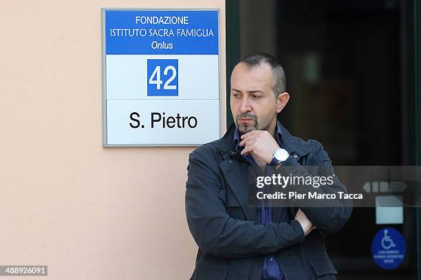 Security personnel stand at the entrance to the hall of the Fondazione Sacra Famiglia in Cesano Boscone on May 9, 2014 in Milan, Italy. Today Silvio...
