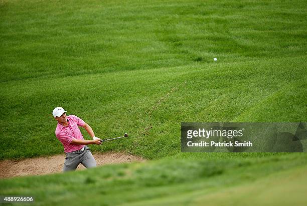 Jordan Spieth plays a shot from a bunker on the eighth hole during the Second Round of the BMW Championship at Conway Farms Golf Club on September...