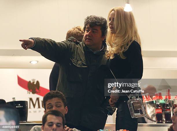 Zlatan's agent Mino Raiola and Zlatan's wife Helena Seger Ibrahimovic, holding a Chanel Perfume Bottle Clutch attend the french Ligue 1 match between...