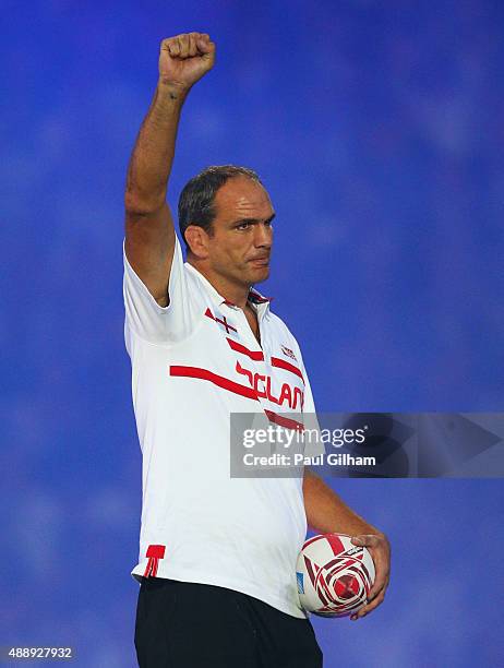 World Cup winning captain Martin Johnson waves during the opening ceremoy ahead of the 2015 Rugby World Cup Pool A match between England and Fiji at...