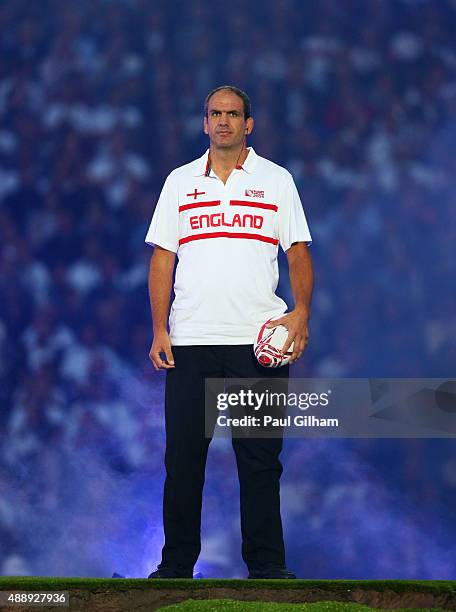 World Cup winning captain Martin Johnson waves during the opening ceremoy ahead of the 2015 Rugby World Cup Pool A match between England and Fiji at...