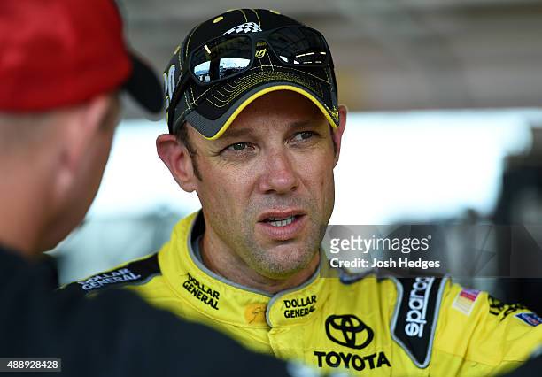 Matt Kenseth, driver of the Reser's Main Street Toyota, stands in the garage area during stands in the garage area during practice for the NASCAR...