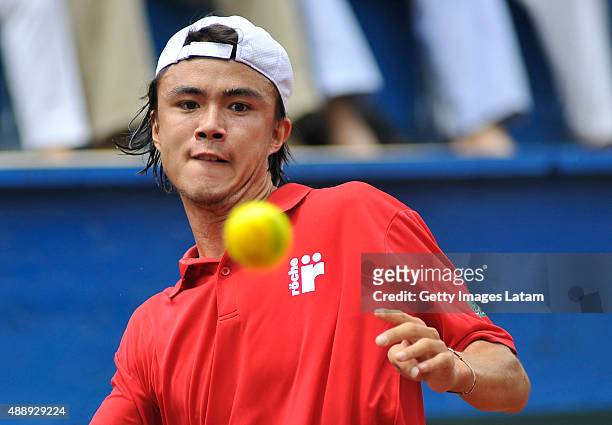 Taro Daniel of Japan in action during the Davis Cup World Group Play-off singles match between Santiago Giraldo of Colombia and Taro Daniel of Japan...