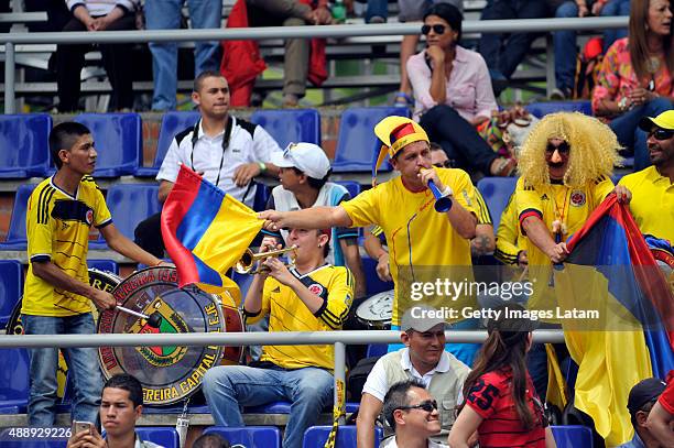 Colombian supporters cheer for their team during the Davis Cup World Group Play-off singles match between Santiago Giraldo of Colombia and Taro...