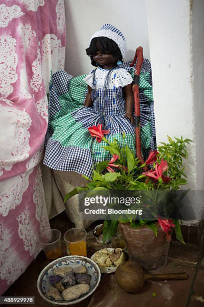 Doll embodying ancestral spirits is placed in a Santeria shrine at a home in Havana, Cuba, on Wednesday, Sept. 17, 2015. Cubans often pray to...