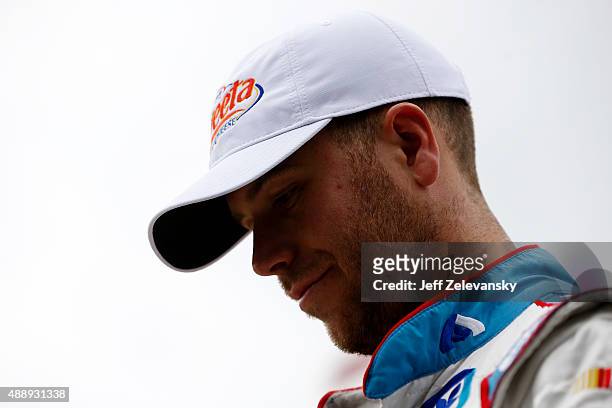 Brian Scott, driver of the Jewel-Osco/Kraft Singles Chevrolet, walks in the garage area during practice for the NASCAR Xfinity Series Furious 7 300...