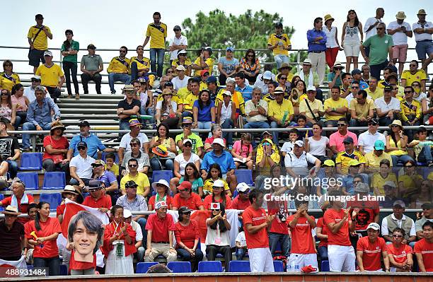 Japanese supporters cheer for their team during the Davis Cup World Group Play-off singles match between Santiago Giraldo of Colombia and Taro Daniel...