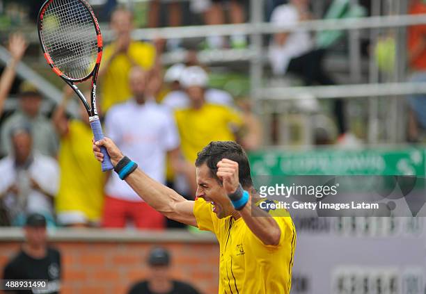 Santiago Giraldo of Colombia celebrates after defeating Taro Daniel of Japan during the Davis Cup World Group Play-off singles match between Santiago...