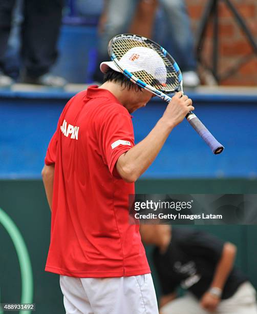 Taro Daniel of Japan reacts after losing the Davis Cup World Group Play-off singles match against Santiago Giraldo of Colombia at Club Campestre on...