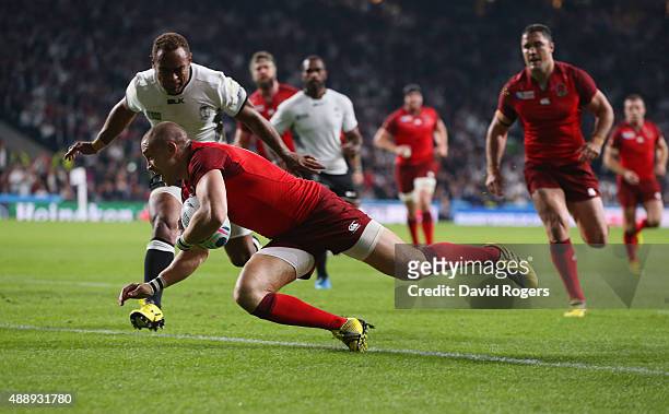 Mike Brown of England goes over to score the second try during the 2015 Rugby World Cup Pool A match between England and Fiji at Twickenham Stadium...