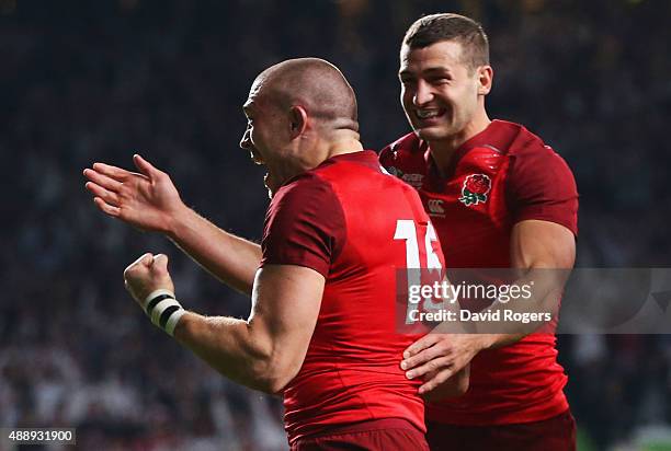 Mike Brown of England cleebrates scoring their second try with Jonny May of England during the 2015 Rugby World Cup Pool A match between England and...