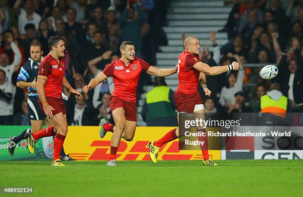 Mike Brown of England cleebrates scoring their second try with Jonny May and Brad Barritt of England during the 2015 Rugby World Cup Pool A match...