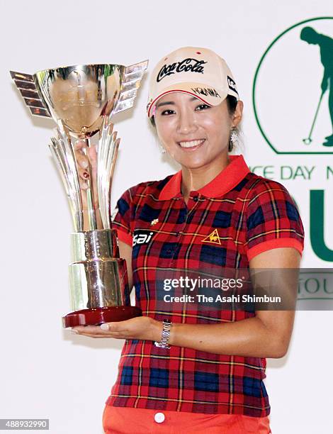 Lee Bo-Mee of South Korea poses for photographs with the trophy after winning the Golf 5 Ladies Tournament 2015 at the Mizunami Country Club on...