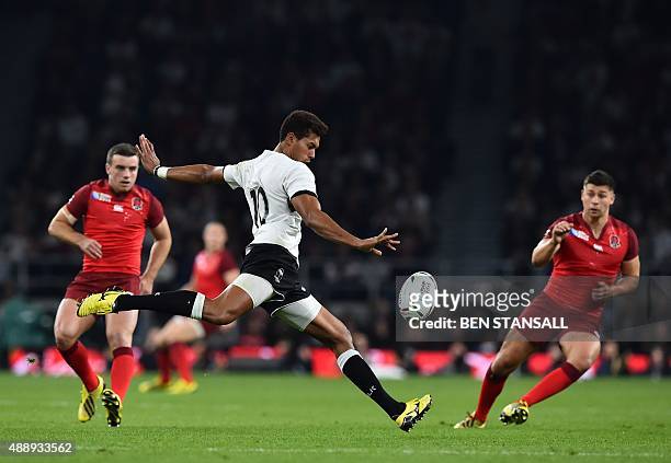 Fiji's fly-half Ben Volavola takes a drop kick during a Pool A match of the 2015 Rugby World Cup between England and Fiji at Twickenham stadium in...