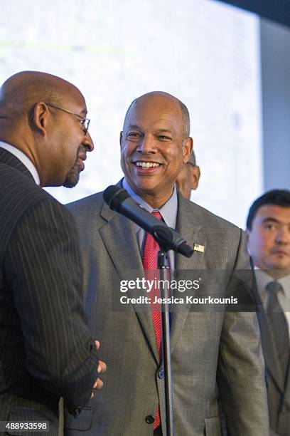 Philadelphia Mayor Michael Nutter shakes hands with Secretary of Homeland Security Jeh Johnson during a joint media availability with other agency...