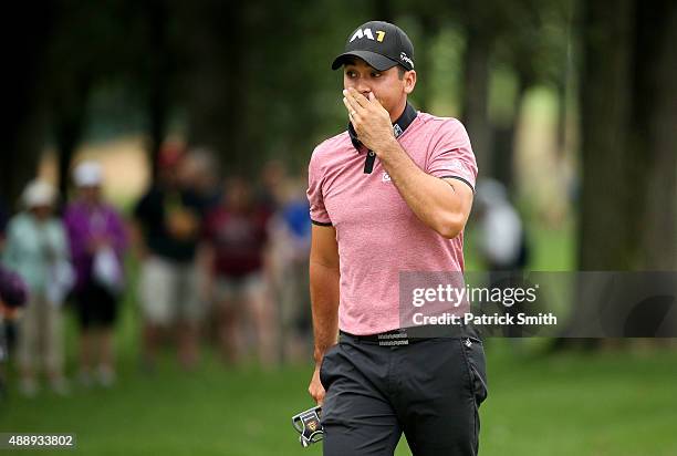 Jason Day of Australia reacts on the 12th green during the Second Round of the BMW Championship at Conway Farms Golf Club on September 18, 2015 in...