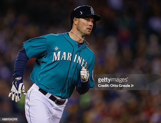 Cole Gillespie of the Seattle Mariners singles in the fifth inning against the Texas Rangers at Safeco Field on April 25, 2014 in Seattle, Washington.