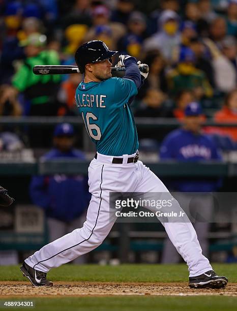 Cole Gillespie of the Seattle Mariners singles in the fifth inning against the Texas Rangers at Safeco Field on April 25, 2014 in Seattle, Washington.
