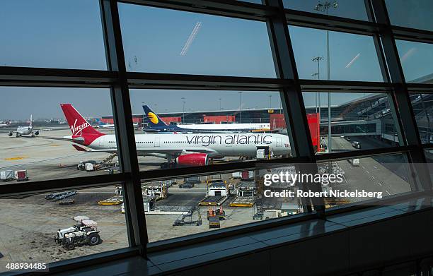 Virgin Atlantic plane is prepared for departure March 9, 2014 by a ground crew at Indira Gandhi International Airport in New Delhi, India.