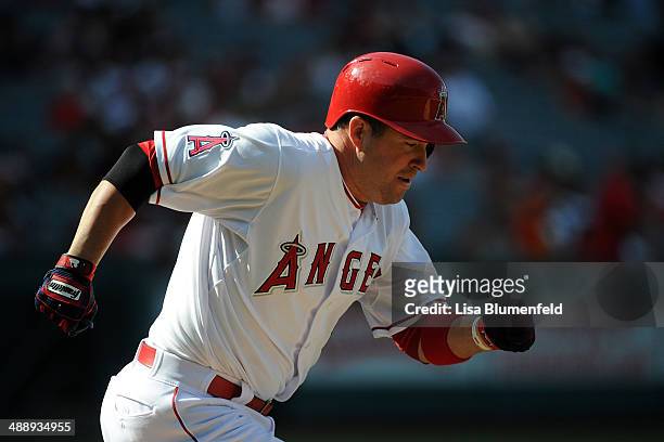 John McDonald of the Los Angeles Angels of Anaheim runs to first base against the Texas Rangers at Angel Stadium of Anaheim on May 4, 2014 in...