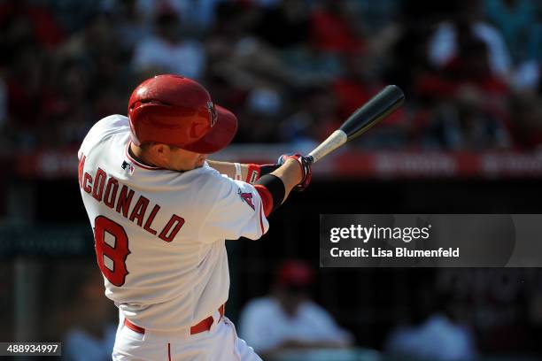 John McDonald of the Los Angeles Angels of Anaheim bats against the Texas Rangers at Angel Stadium of Anaheim on May 4, 2014 in Anaheim, California.