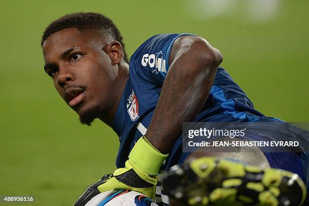 Lille's French Goalkeeper Mike Maignan stops the ball during the French L1 football match between Rennes and Lille on September 18, 2015 at the...