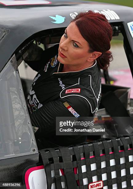 Jennifer Jo Cobb, driver of the Driven2Honor.org/POW-MIA Chevrolet, gets in her truck during qualifying for the NASCAR Camping World Truck Series...