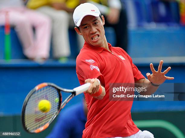 Kei Nishikori of Japan returns a forehand shot during the Davis Cup World Group Play-off singles match between Alejandro Falla of Colombia and Kei...