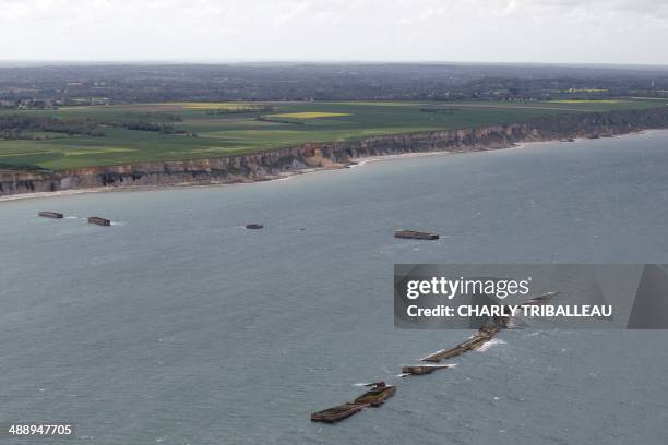 Picture taken on May 7, 2014 shows the remains of the WWII "Mulberry harbour" on the beach of Arromanches-les-Bains, northwestern France, ahead of...