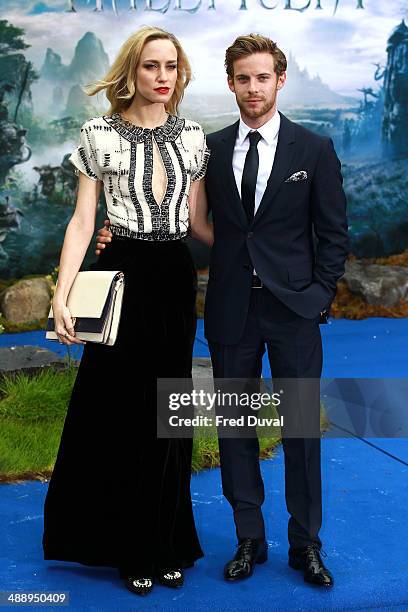 Ruta Gedmintas and Luke Treadaway attend a private reception as costumes and props from Disney's "Maleficent" are exhibited in support of Great...