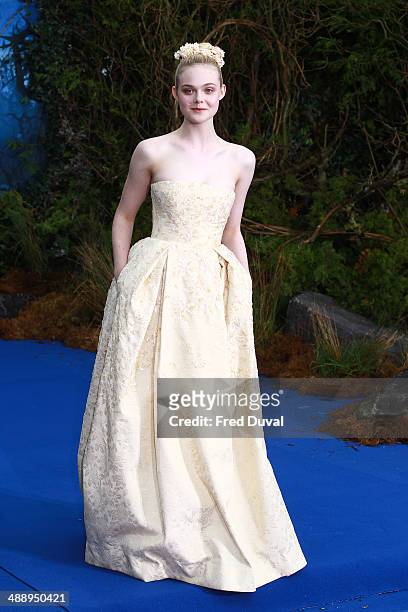Elle Fanning attends a private reception as costumes and props from Disney's "Maleficent" are exhibited in support of Great Ormond Street Hospital at...